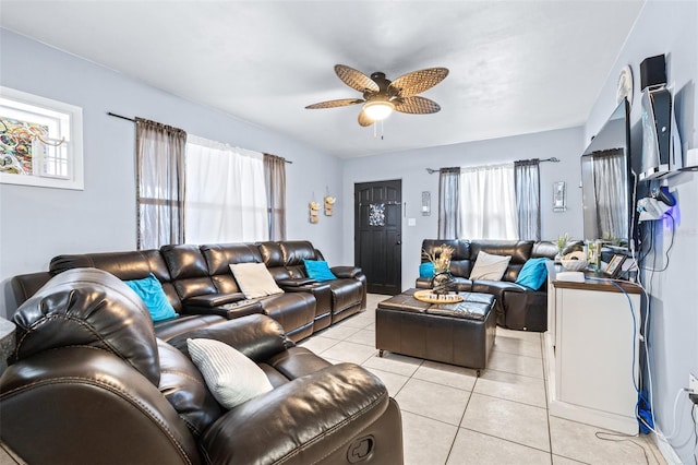 living area featuring light tile patterned floors and a ceiling fan