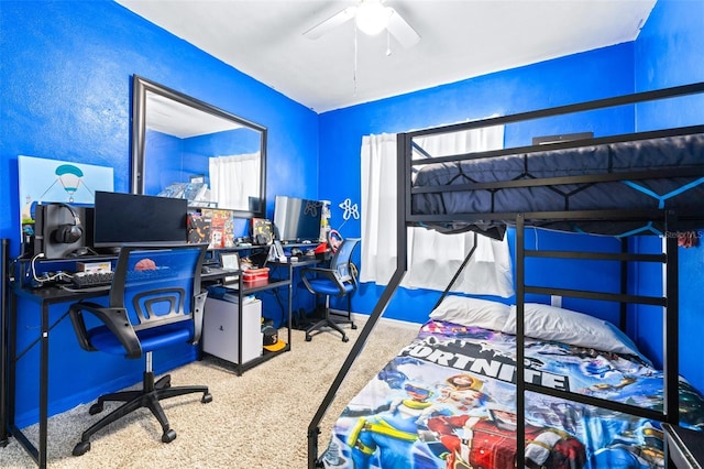 bedroom with a ceiling fan and carpet flooring