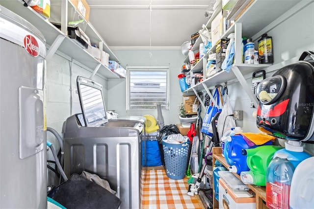 interior space with washer and clothes dryer and electric water heater