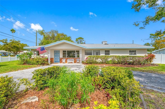 ranch-style house with fence and stucco siding