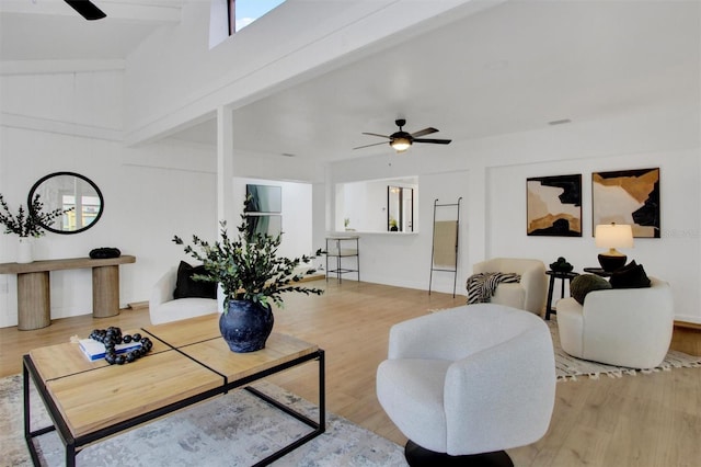 living room with a ceiling fan and wood finished floors