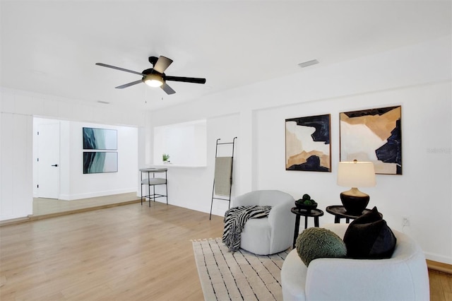 sitting room featuring ceiling fan and light wood-style floors