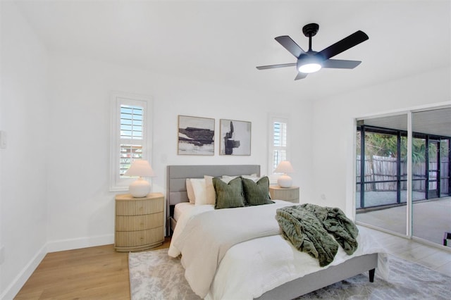 bedroom with light wood-style floors, access to outside, baseboards, and a ceiling fan