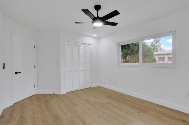 unfurnished bedroom with light wood finished floors, ceiling fan, baseboards, and recessed lighting