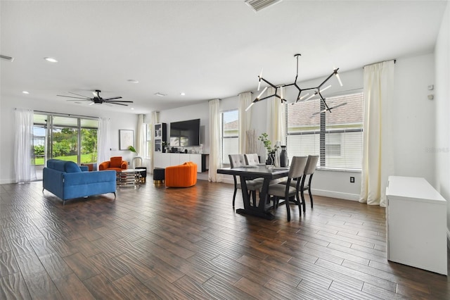 dining space with dark wood-style floors, visible vents, and recessed lighting