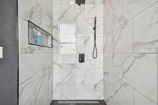 bathroom with tiled shower