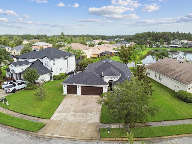 aerial view with a water view and a residential view