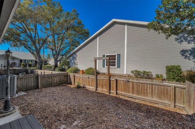 view of yard featuring cooling unit and fence private yard