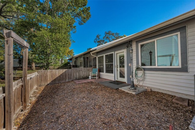 view of yard featuring a patio and a fenced backyard