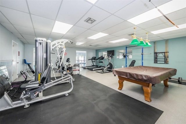 gym with pool table, a paneled ceiling, and visible vents