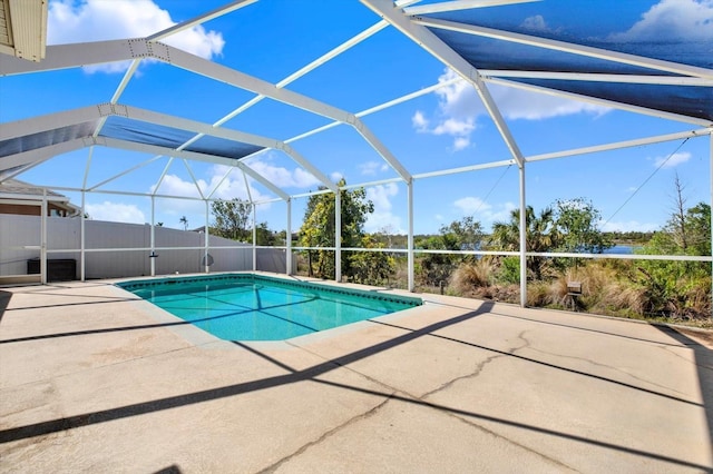 view of swimming pool featuring a patio, a lanai, and a fenced in pool