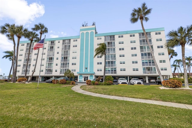 view of building exterior featuring uncovered parking