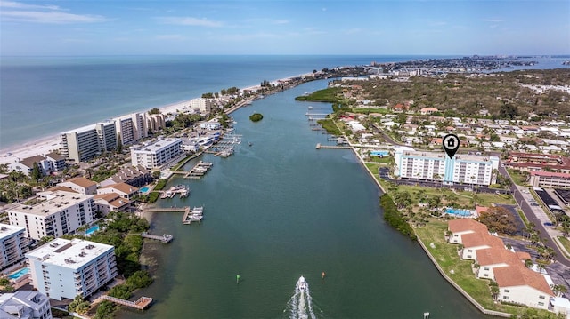 birds eye view of property with a water view and a city view