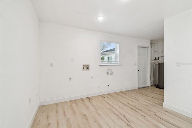 unfurnished room featuring light wood-type flooring and baseboards