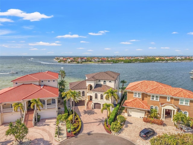 exterior space featuring a residential view and a water view