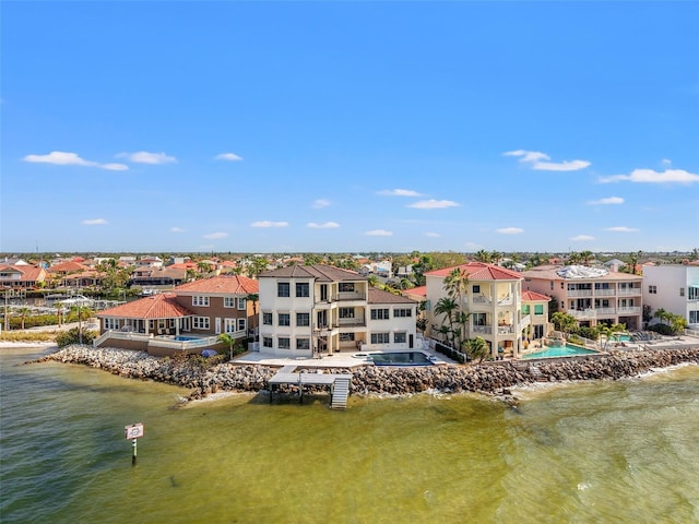 bird's eye view with a residential view and a water view