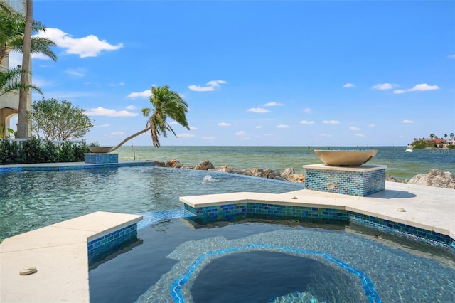 view of pool with a water view and an infinity pool