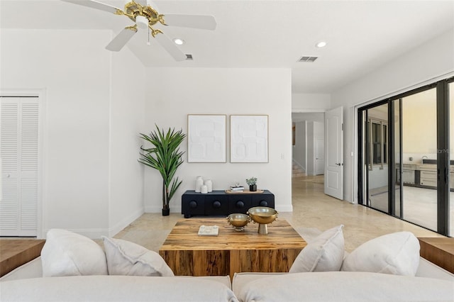 living room featuring recessed lighting, visible vents, baseboards, and stairway