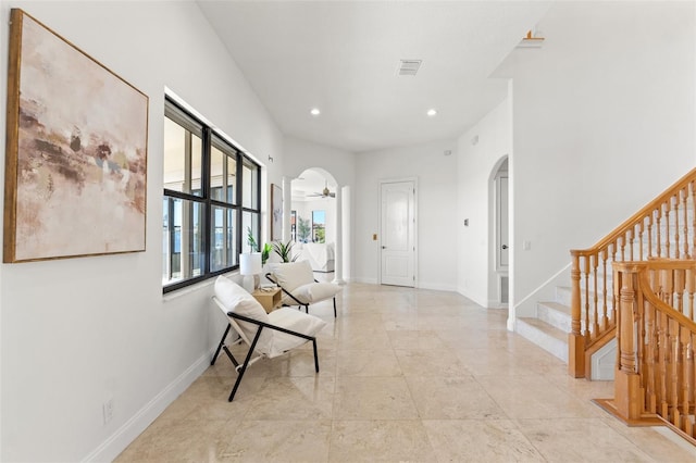 entryway featuring recessed lighting, visible vents, arched walkways, and baseboards