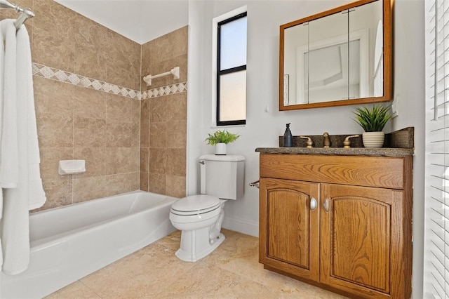 full bath featuring toilet, tile patterned flooring, baseboards, bathing tub / shower combination, and vanity