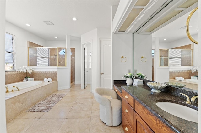 bathroom with a shower stall, a garden tub, recessed lighting, tile patterned floors, and vanity