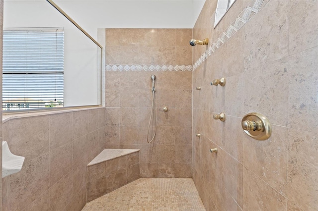 full bath with a tile shower