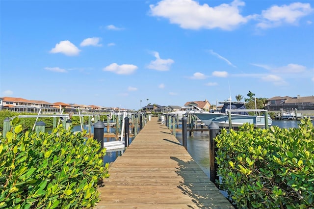 view of dock with a water view and boat lift