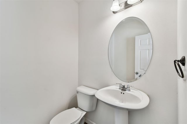 bathroom featuring a sink and toilet