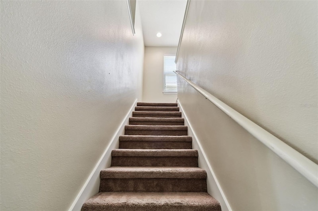 stairs with a textured wall