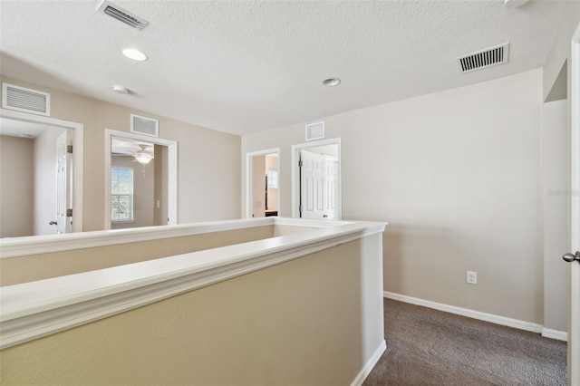 hallway featuring visible vents