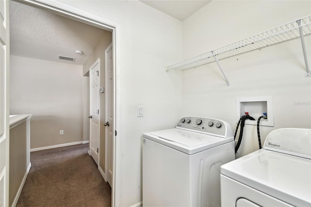 laundry area featuring laundry area, baseboards, visible vents, independent washer and dryer, and carpet floors