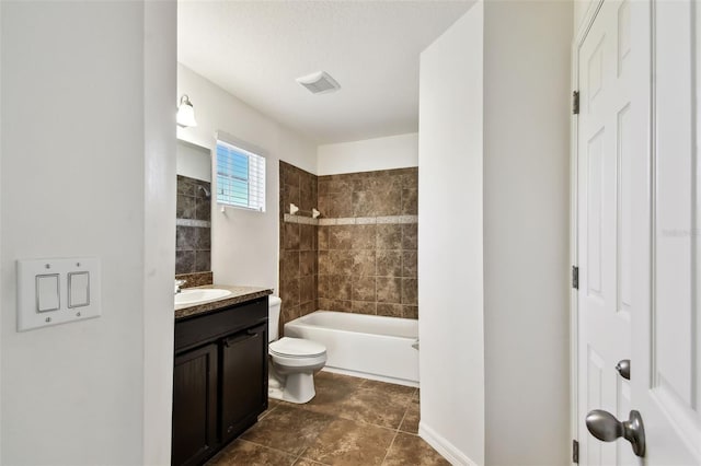 bathroom featuring toilet, tub / shower combination, a textured ceiling, and vanity