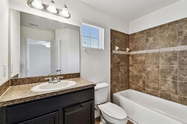 full bath featuring visible vents, shower / tub combination, vanity, and toilet