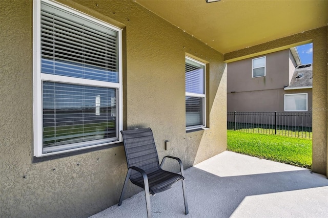 view of patio featuring fence