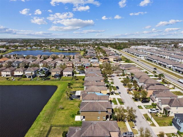 bird's eye view featuring a residential view and a water view