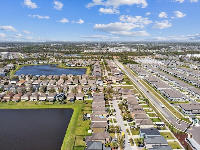 bird's eye view with a residential view and a water view