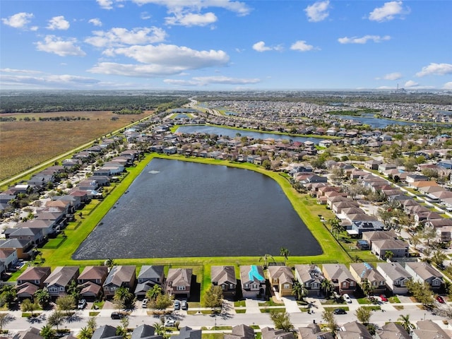 birds eye view of property featuring a water view and a residential view