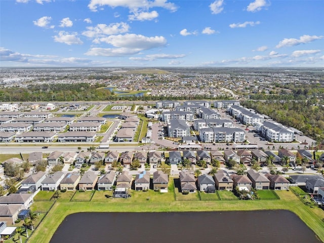 birds eye view of property with a residential view and a water view