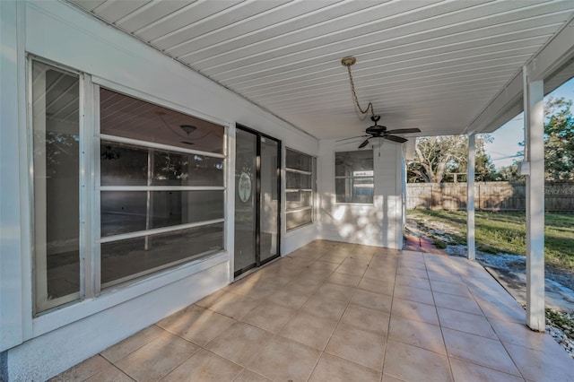 view of patio featuring fence and ceiling fan