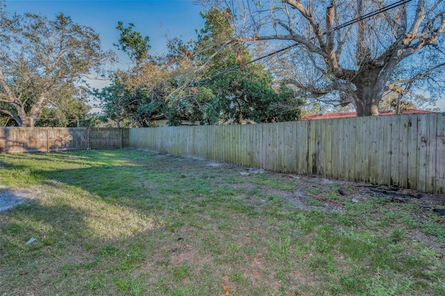 view of yard with a fenced backyard