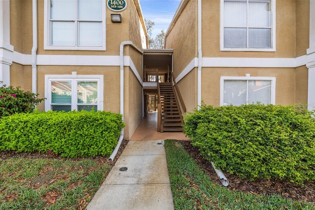 view of exterior entry with stucco siding