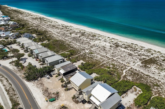 bird's eye view with a view of the beach and a water view