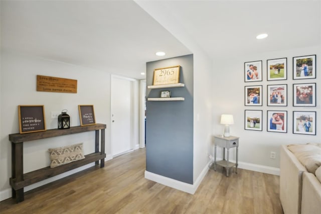 sitting room with recessed lighting, wood finished floors, and baseboards