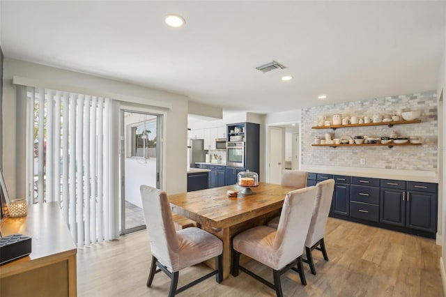 dining space featuring visible vents, recessed lighting, and light wood-style floors