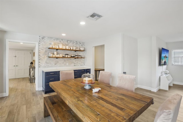 dining room featuring recessed lighting, visible vents, baseboards, and light wood finished floors