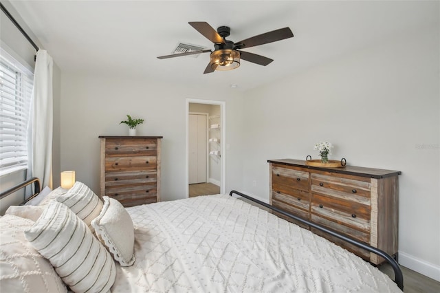 bedroom with baseboards and a ceiling fan