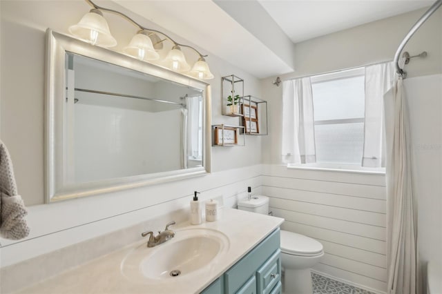 full bath featuring a shower with curtain, wood walls, vanity, and toilet