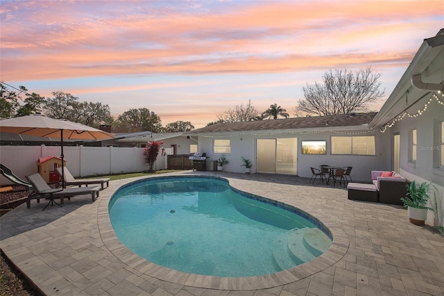 view of pool with a fenced backyard, a fenced in pool, and a patio