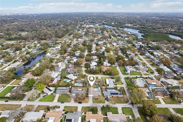 birds eye view of property featuring a water view and a residential view