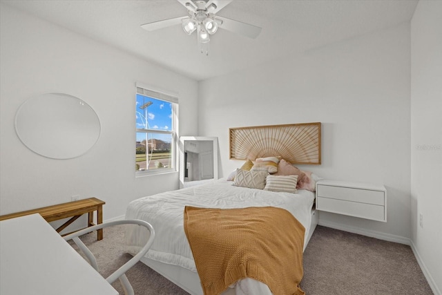 carpeted bedroom featuring ceiling fan and baseboards